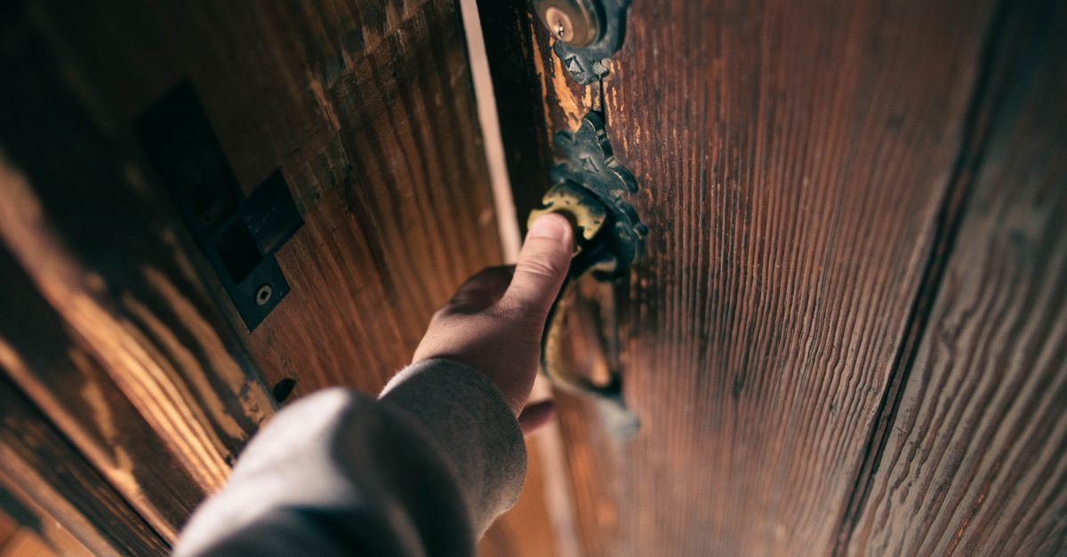 locksmith unlocking front door — Bradenton Locksmith Pro